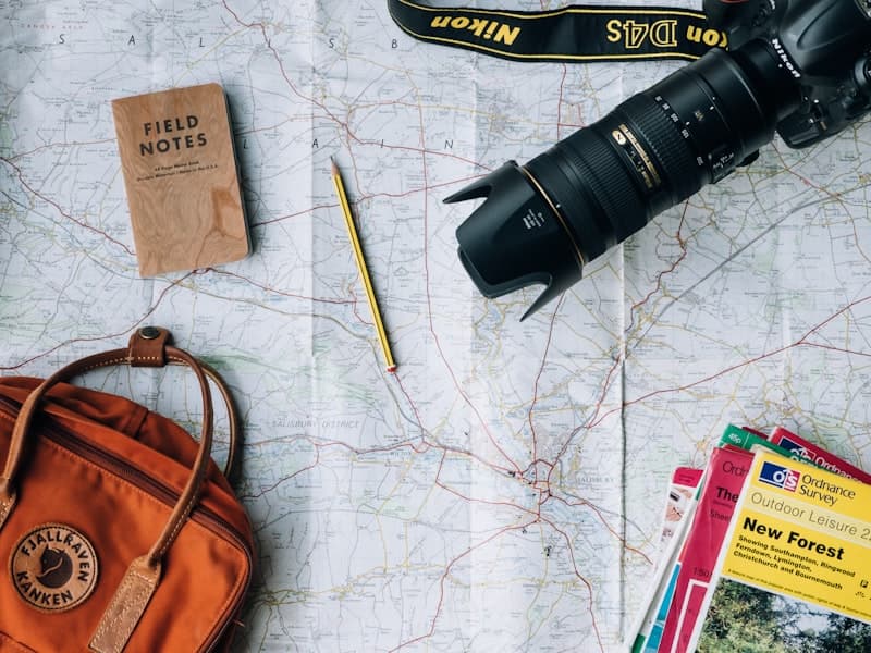 Travel map and booking planning on a desk